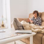 relaxed-woman-using-her-cell-phone-home_23-2147601401